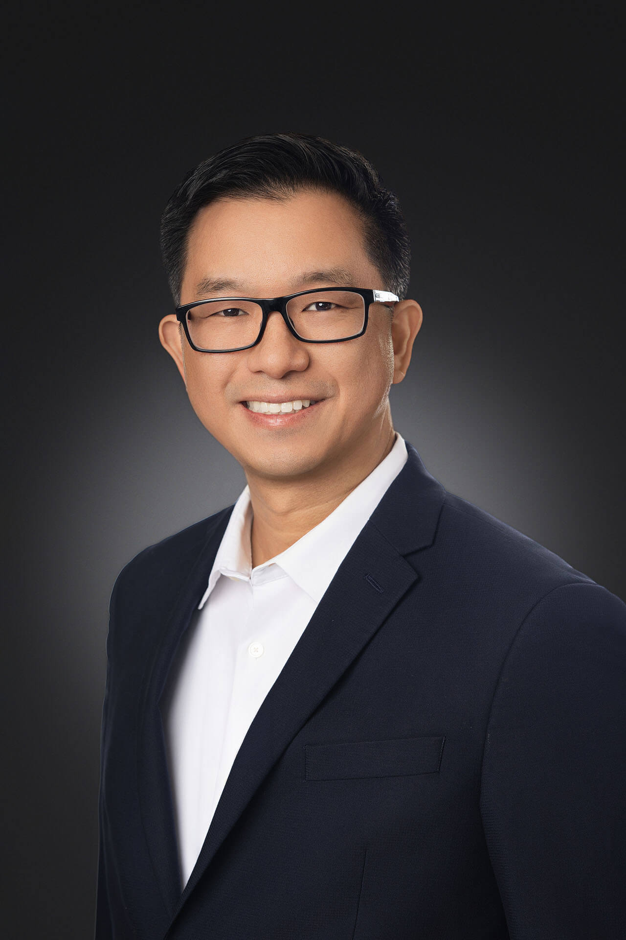 executive-headshot-man-navy-blazer-glasses Corporate Team Headshots Bay Area | TTB Studio - TTB Studio