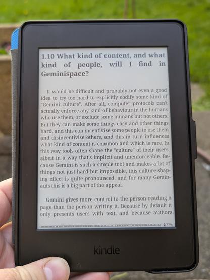 The Gemini FAQ being read in a garden on a Kindle Paperwhite eReader.