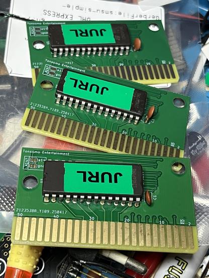Three PCBs each with a chip with a label that says Jurl