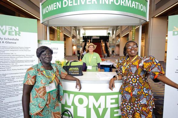 ways to welcome attendees: photograph of welcoming women at the Women Deliver Conference