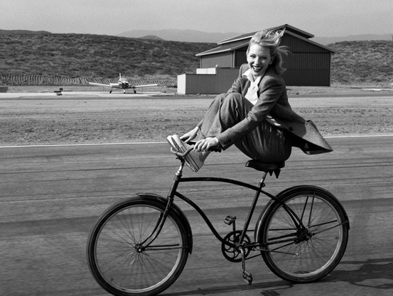 Cate Blanchett riding a bicycle