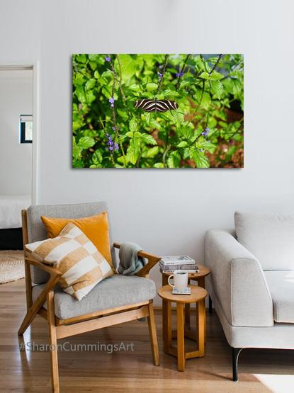 Zebra butterfly in green and purple flowers in a furniture setting by photographer Sharon Cummings.  Haiku in post.