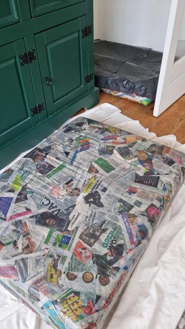 Applying paper soaked in the flour glue on the pillow - the whole surface looks like newspaper