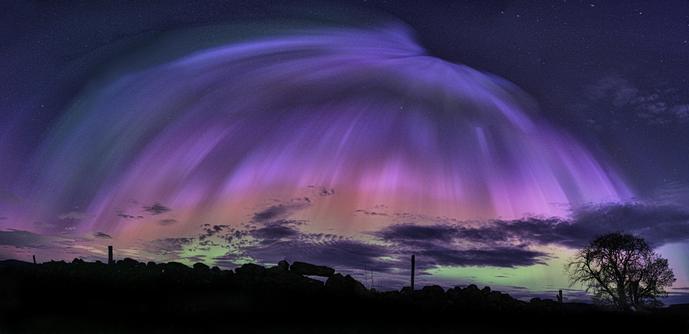An image of the multi coloured Aurora in the night sky over North East Scotland.