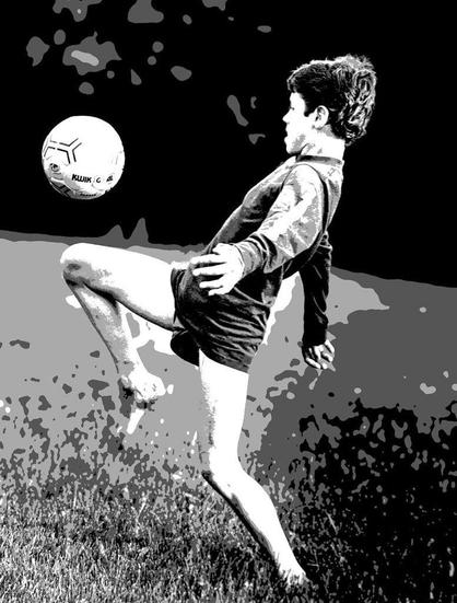 This posterized black-and-white image captures a young soccer player juggling the ball, frozen at peak action. The dynamic balance emphasizes the energy and grace young players bring to the field.

Perfect for any sports enthusiast or to inspire the young athletes, this piece adds movement and excitement to their space or yours, bringing the spirit of the game into your home or office.