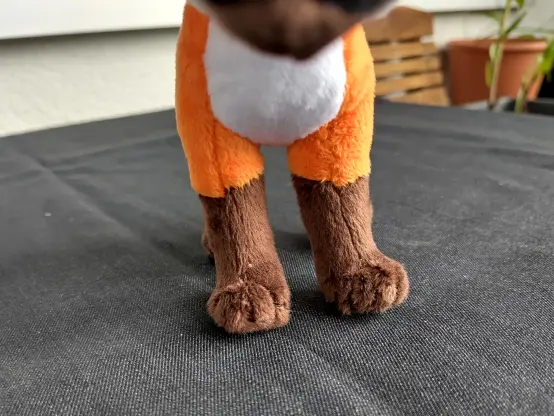 Close up of the paws of the small plushie. They are still slightly defined to resemble tiny toes.
