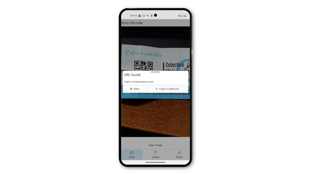 This image is of a phone showing the Qrca app in action, snapping and reading a QR code from bent business card.