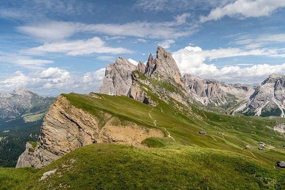 A rocky mountain landscape with blue sky.