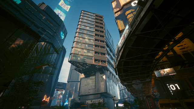 Cyberpunk 2077 in-game photo showing an upward shot of the Militech building at Corpo Plaza, including surrounding buildings, advertising boards, etc.