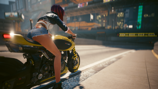 Cyberpunk 2077 in-game photos showing V on a motorcycle coming off the freeway and headed into Night City. The shots are from two different angles, left and right of V, but are similar overall. This is a shot from the right of V.