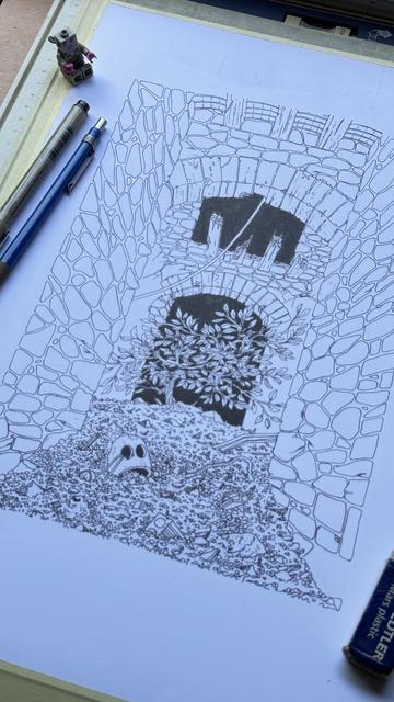 A detailed line drawing of a stone archway leading to a shadowy area in a ruined building, with a small tree over a pile of debris. There is a robot skull partially covered in the dirt. Nearby the drawing are some art supplies, including pens and a Lego minifigure of a lady robot.