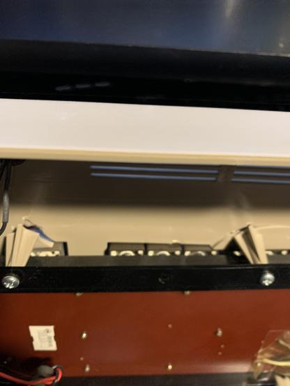 Inside view of the broken alley board screw mounts. Right most is fully separated (around the function keys). The next screw mount is only cracked.