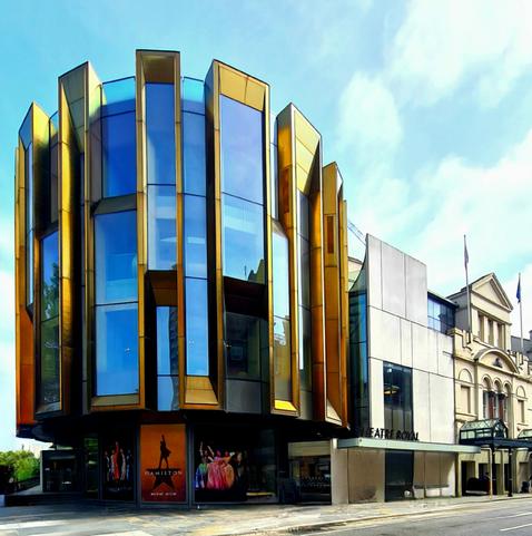 A modern section of metal and glass added to a Victorian theatre in Glasgow.
