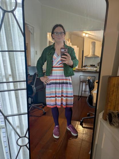 Mirror selfie of me wearing the stripey dress outfit in the flat lay.