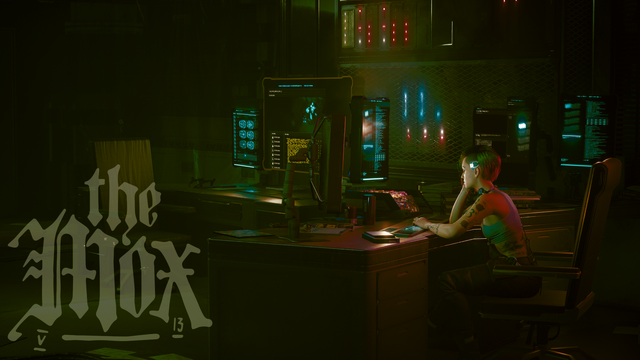 Cyberpunk 2077 in-game photo showing Judy Alvarez sitting at her desk at the Moxes' headquarters in Lizzie's Bar. She has one hand by her cheek with the elbow on the desk as if sleeping. The other hand is over her keyboard. In the bottom-left is the Mox logo.