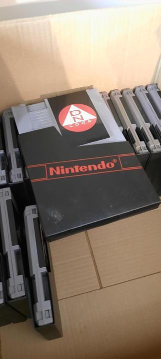 a box of original NES cartridges and sleeves, now with a new label for What Remains.