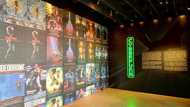 A wall of cyberpunk movie poster and the cinematic impact. Videodrome, Bladerunner, and others are shown.