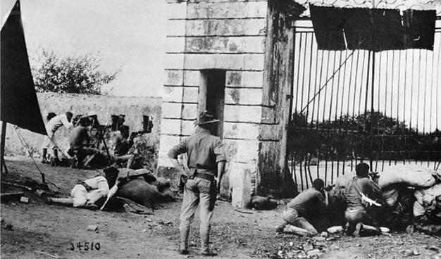 United States Marines in 1915 defending entrance gate in Cap-Haïtien. By East Oregonian - East Oregonian : E.O., October 21, 1915, DAILY EVENING EDITION, Image 1, Public Domain, https://commons.wikimedia.org/w/index.php?curid=44365405