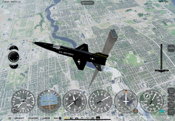A plane flying high over a virtual city. There is one very narrow building towering into the skies.
