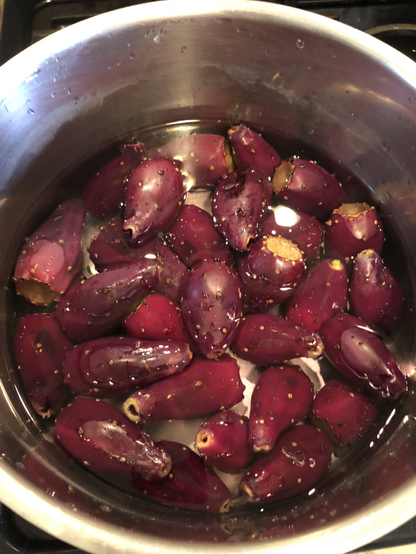 Deep purple tunas simmering on stove