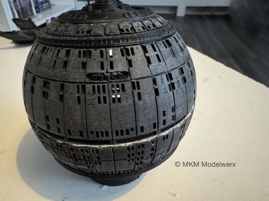 Closeup of the front of the sphere showing a smoother surface on the top half.