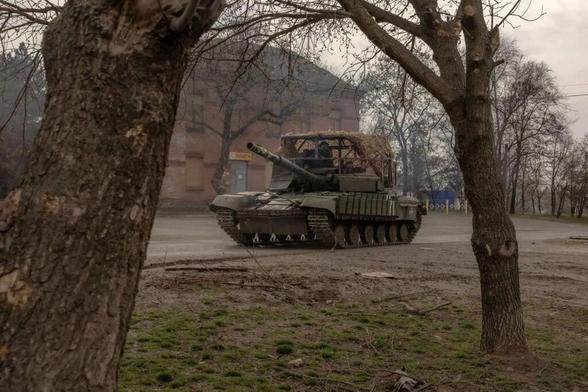 Ukrainian tank drives on a road in a village in Dnipropetrovsk Oblast, Spring 2025