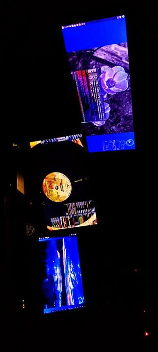 The photograph composed in absolute darkness, shows a collage of four? IPS LED panels, each displaying different content. The top screen features a blue background with a flower image and a text editor window with code. The middle screen displays a vinyl record label with a colorful design and a digital audio workstation interface. The bottom screen shows a blue-toned image with abstract patterns, possibly a visualizer or a live performance. The screens are arranged vertically, with the top screen at the top, the middle screen in the center, and the bottom screen at the bottom. The background is dark, emphasizing the screens' content.

Provided by @altbot, generated privately and locally using Ovis2-8B

🌱 Energy used: 0.153 Wh