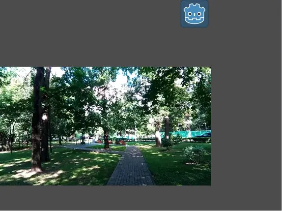 A demonstration of the frame blending effect using the Godot icon and some video I found on the internet of a forest park in a city.