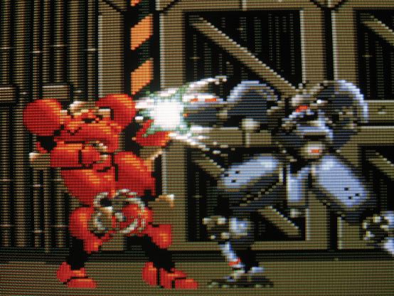 Facing a rival mech, Eve gets drill punched in the face.