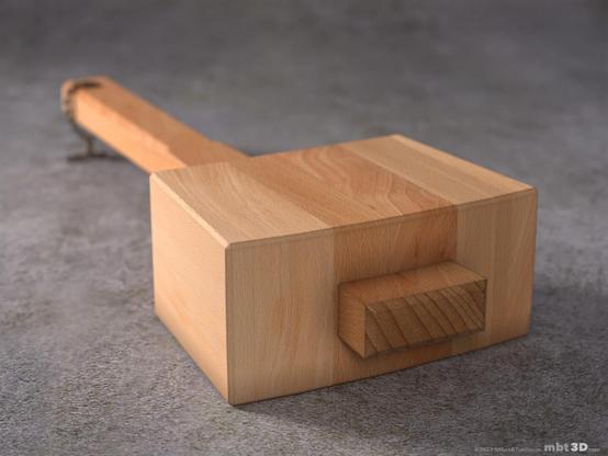Beech wood mallet laying flat on a stone surface, viewed from the head.