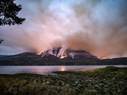 Massive fire burns on mountain near western Canada city
