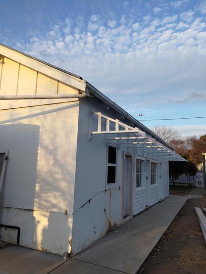New timber frame on the side of an old Federation home ready for the galvanised corrugated iron sheets to keep everyone on the side path dry on a wet day & the summer sun off the large windows on the southern side of my home.