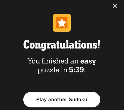 Congratulations message from a Sudoku game, featuring a yellow square with a white star, the text "Congratulations! You finished an easy puzzle in 5:39", a button labeled "Play another Sudoku" and a close button.