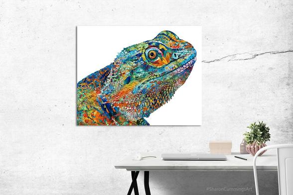 Colorful bearded dragon collage art by artist Sharon Cummings.  In an office setting with a desk.