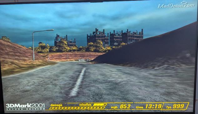 A screenshot of the first test of 3D mark 2001. A racing game simulation showing the frame rate pinned at 999 FPS.