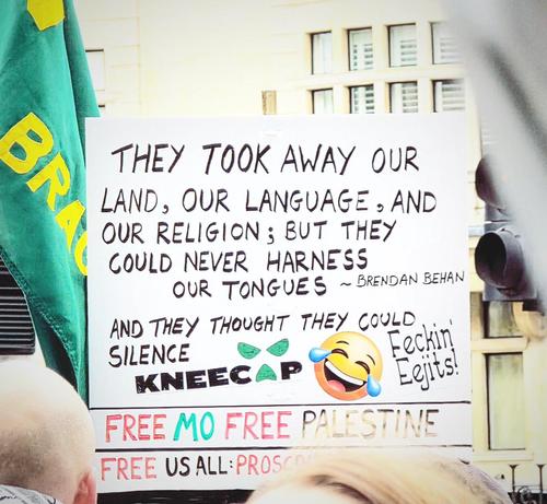 Banner with a lot of text including "they could never harness our tongues and they thought they could silence Kneecap 🤣"