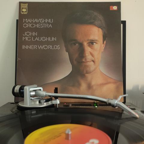 LP sleeve of John McLaughlin/Mahavishnu Orchestra - Inner Worlds propped up behind a turntable which is playing the album.