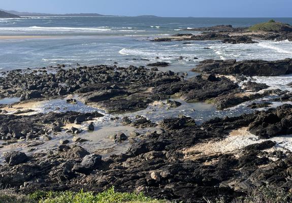 Thick brown foam at Sawtell after rain, NSW