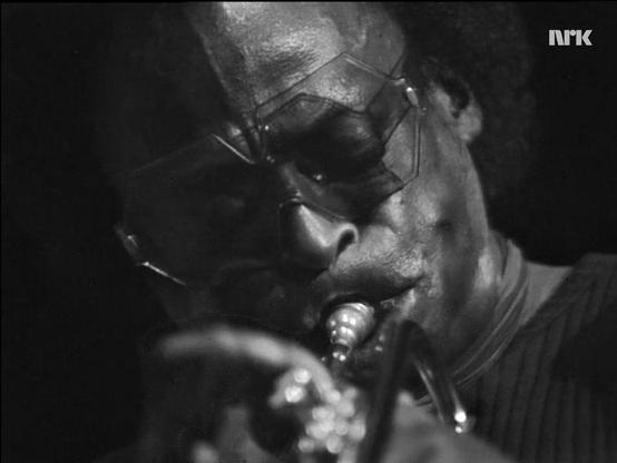 NRK b/w close-up screen capture of Miles Davis playing his trumpet