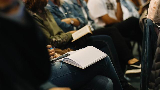 A random selection of people listening to a talk at a conference. Photo by Sincerely Media on Unsplash.