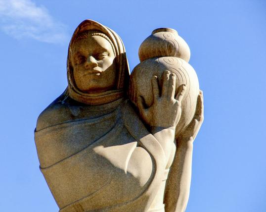 San Diego Street Art Native woman carrying a water jug, centerpiece of a fountain.