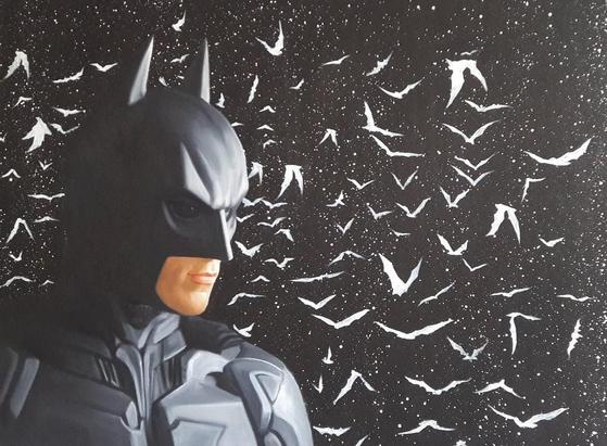 a painting of batman in a black armored suit, against a black background of splattered white paint, white silhouettes of bats behind him
