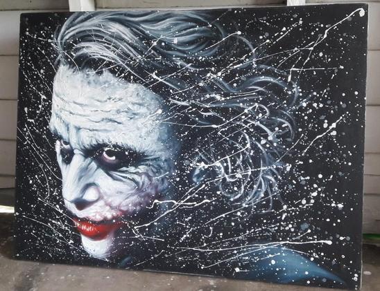 a painting of the joker's face, facing left , white splatter soming all around it, a dead stare on his scary face, his hair flying back