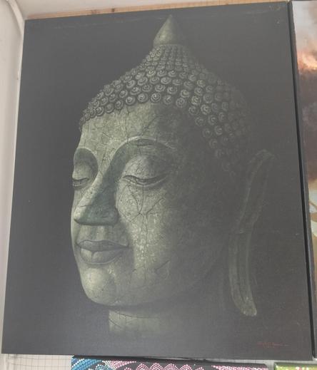a painting of the face of the buddha, he is made of stone, seen from the right side in a three quarter view, he is emerging from the shadows