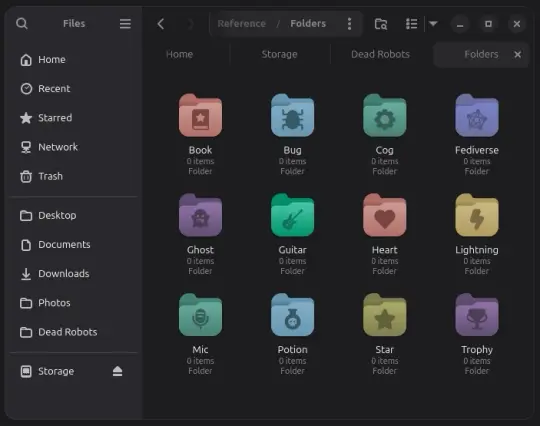 Shows a window on the Linux Desktop. The side panal lists places. The main window contains multicoloured rounded folders with various icons in the centre.