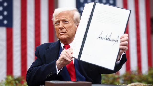 Donald Trump holds up a signed executive order implementing new reciprocal tariffs Donald Trump holds up a signed executive order implementing new reciprocal tariffs