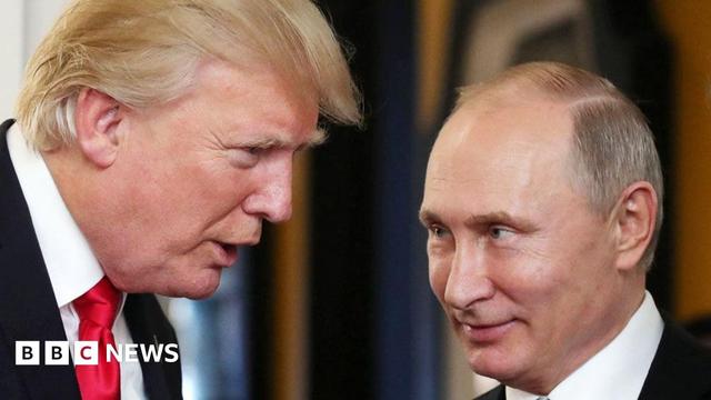 US President Donald Trump (L) chats with Russia's President Vladimir Putin as they attend the APEC Economic Leaders' Meeting, part of the Asia-Pacific Economic Cooperation (APEC) leaders' summit in the central Vietnamese city of Danang on November 11, 2017.