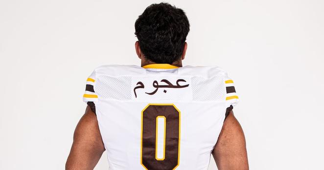 Western Michigan University defensive tackle Mustafi Al-Garawi is one of the first division I US football players to have Arabic script on his jersey's nameplate. The name on the jersey - Ajoum - is his family name, while Al-Garawi is the name of his clan. 