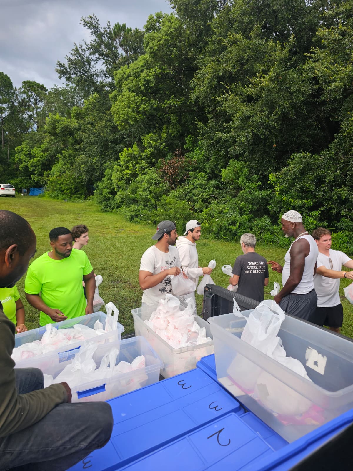 Relief Alliance and JFC For You Outreach working together to distribute food, clothing, and support to homeless individuals and families in need during a local community outreach event in Florida.