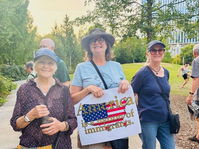 Meeting Members smile in appreciation for the community that turned up.